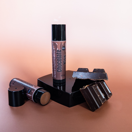 Chocolate-flavored lip balm with packaging on a gradient background