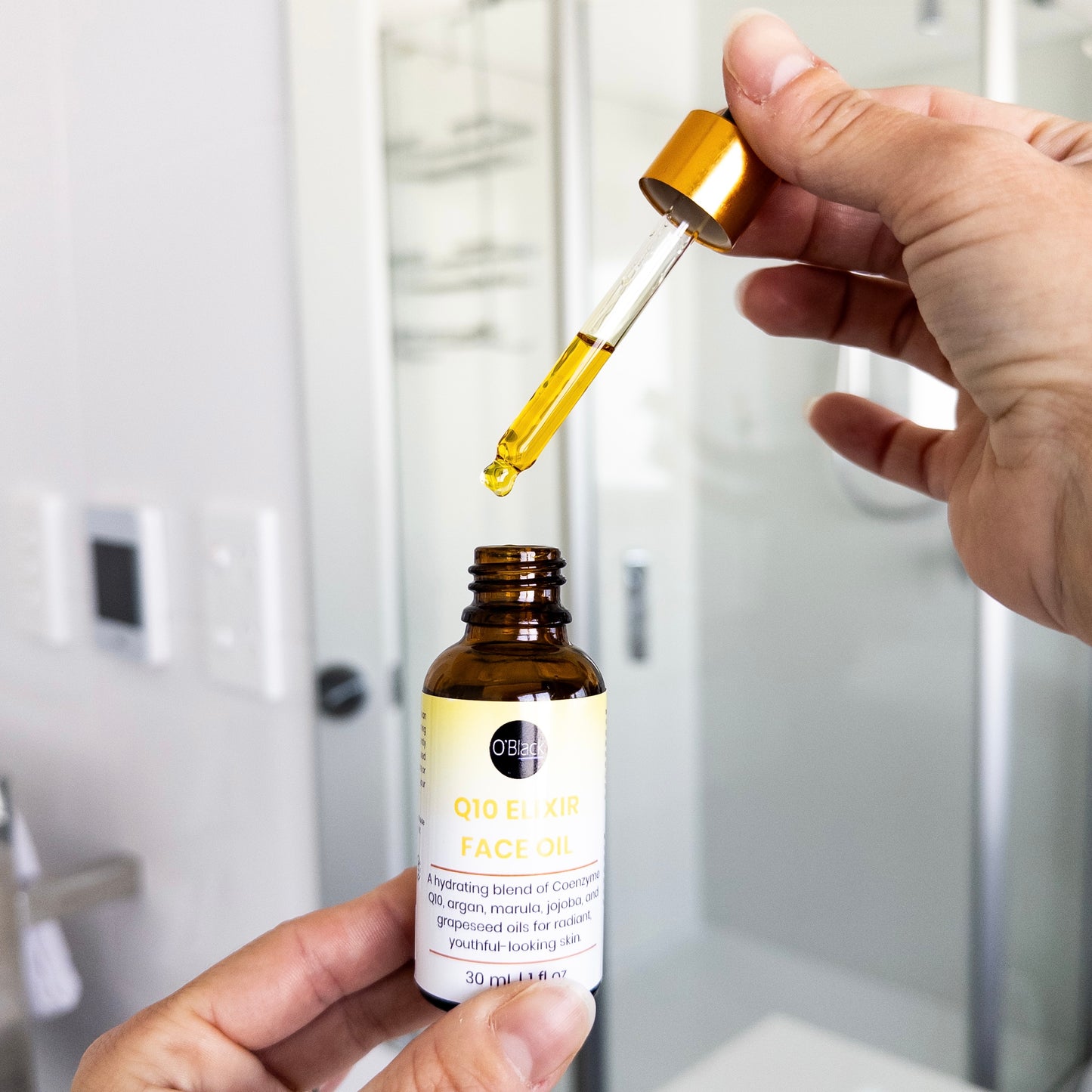 Open bottle of Q10 Elixir Face Oil