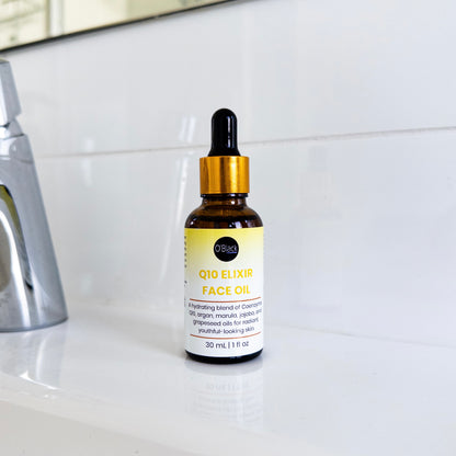 Bottle of Q10 Elixir Face Oil on a bathroom counter