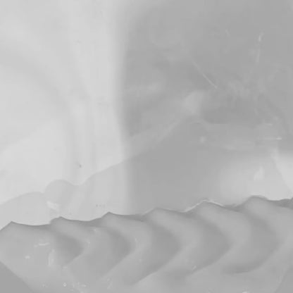 spreading face cream on the surface